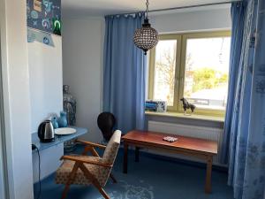 a dining room with a table and a window at Lalala in Sopot +52 photos