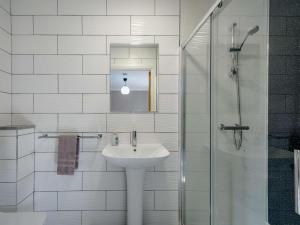 a white bathroom with a sink and a shower at 3 Bed in Alexandria oc-88758 in Balloch +6 photos