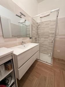 a bathroom with a sink and a shower at Il gelso in Bovalino Marina +10 photos