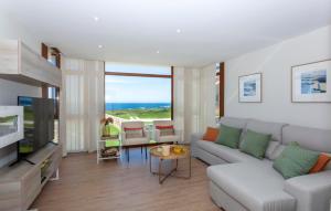 a living room with a couch and a table at Casa do Seixo in Oia