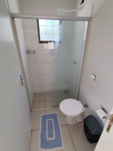a small bathroom with a toilet and a shower at Aconchego 3 - Self Check-in in Presidente Prudente +41 photos