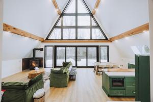 a large living room with a large window at Green Mountain Yay Frame in Killington