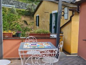 a table and chairs sitting on a patio at Soleluna in Levanto