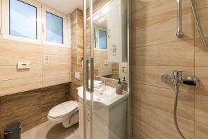 a bathroom with a toilet and a sink and a shower at CentRooms Kovac1 in Zadar