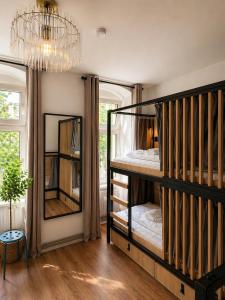 a room with a bunk bed and a mirror at Berlin Sleep Club in Berlin