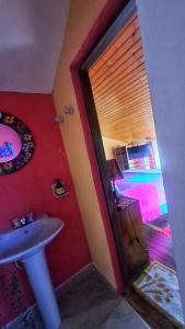 a bathroom with a sink and a room with a bed at El Pedregal Sopó in Sopó +122 photos
