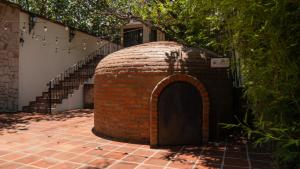 a brick building with a door in front of a staircase at Quinta San Ignacio in Guadalajara