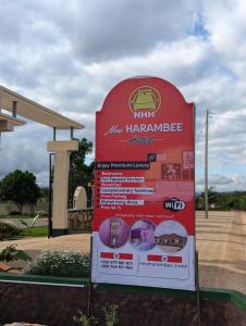 a sign in front of a building at New Harambee Hotel in Nakwa