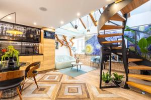 a room with a spiral staircase and a living room at Apartment Luxury Palace No1 in Split