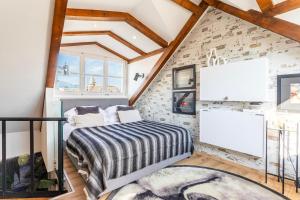 a bedroom with a bed and a brick wall at Apartment Luxury Palace No1 in Split +178 photos