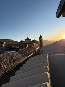 a view of the sunset from the roof of a building at Hotel Gran Libertador in Potosí