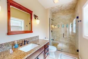 a bathroom with a sink and a shower at Anchors Aweigh in Edgewater +17 photos