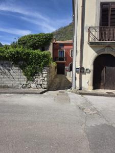 a building with a door on the side of a street at Domus Anemone B&B in Avellino