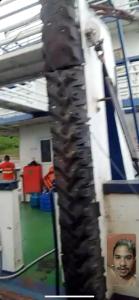 a close up of a motorcycle tire in a room at Praia dos sonhos 123 in Diadema