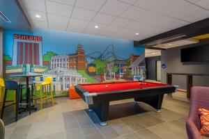 a room with a pool table and a mural at Tru By Hilton Ashland, Va in Ashland +1 photo