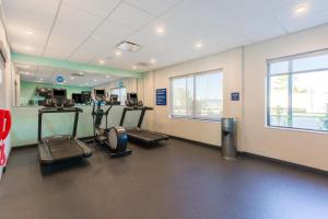 a gym with treadmills and ellipticals in a room at Tru By Hilton Ashland, Va in Ashland