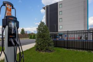 a gas pump in front of a building at Tru By Hilton Ashland, Va in Ashland