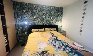 a bedroom with a bed with a peacock on it at Casa Sandra Elisa - Studio aan water in Maasmechelen