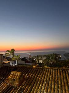 a view of the sunset from the roof of a building at Hotel Boutique Alcalá Vallarta in Puerto Vallarta +16 photos