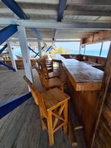 a bar on the deck of a boat at Hotel Isla Gaviota in Tintipan Island +50 photos