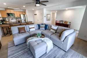 a living room with a couch and two couches at Sunset Lakefront Retreat with Luxe Upgrades in Osage Beach
