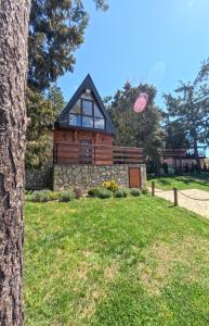 a house with a pink frisbee in the air at Vila Paradiso in Zlatibor