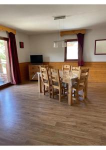 a dining room with a table and chairs at Appartement, 6 pers Casserousse 310 in Chamrousse
