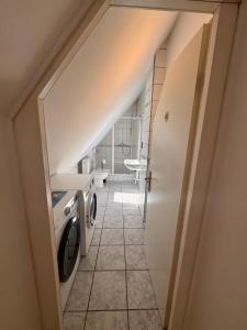 a laundry room with a washer and dryer at Bavaria Home Kitchen Parks No 5 in Geisenfeld
