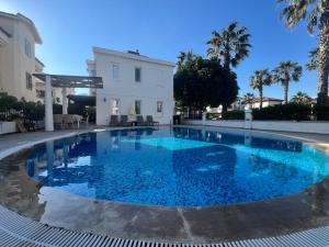 a large swimming pool in front of a building at Dalyan Villa in Dalyan
