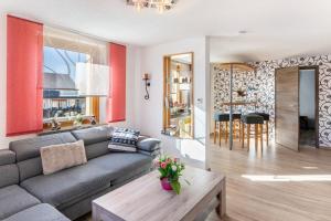 a living room with a couch and a table at Haus Schmucker in Hohekreuz