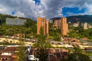 a view of a city with buildings and trees at The Morgana Poblado Suites Hotel in Medellín