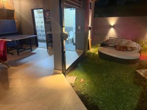 a room with a bed on a patch of grass at Hostel amplio y confortable in Munro