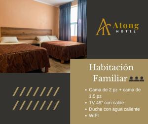 a hotel room with two beds and a sign for a hotel at Atong Hotel in Chancay