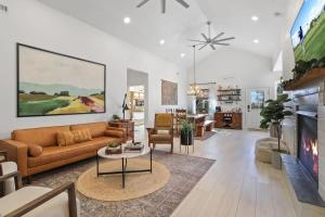 a living room with a couch and a table at Blue Betty Acre in Overgaard