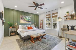 a bedroom with a bed and a ceiling fan at Blue Betty Acre in Overgaard