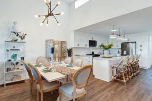 a kitchen and dining room with a table and chairs at Courtyard-Patio-Moutain and V3872-Holly House in Palm Desert