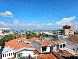 a view of the city from the roofs of buildings at Hotel Casa Cristales in Cali