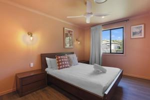 a bedroom with a bed with a stuffed animal on it at Amity Duo - Roys in Amity Point