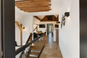a hallway of a house with wooden ceilings at Vogtlandstadl - Vogtland Chalet in Bad Brambach