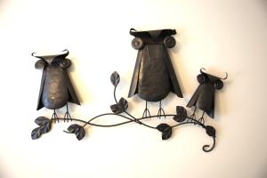 a group of three black coat hooks hanging on a wall at Retreat on First Street in Prescott