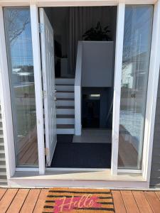 a sliding glass door on a house with a porch at Peaceful Stratford Home Bed and Breakfast - 2 BR Lower Level in Stratford