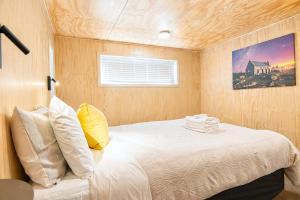 a bedroom with a bed in a small room at Serene Star in Lake Tekapo