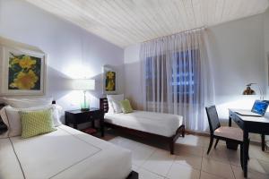 Letto o letti in una camera di Carlisle Bay