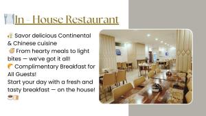 a picture of a dining room with tables and chairs at Sreeparthi Hotel in Puttaparthi