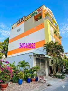 a building with a sign on the side of it at Ngoc Kha Tu 1 Hotel in Long Xuyên