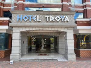a hotel twoida sign in front of a building at Hotel Troya in Ibarra
