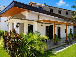 a house with a courtyard and plants at YANTO BEACH HAUS at CAGWAIT WHITE BEACH in Cagwait