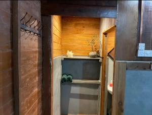 a small room with a cat sitting on a shelf at Cool Banyan Cabana in Trincomalee +67 photos