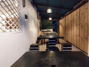 a dining room with a table and some chairs at YANTO BEACH HAUS at CAGWAIT WHITE BEACH in Cagwait +69 photos
