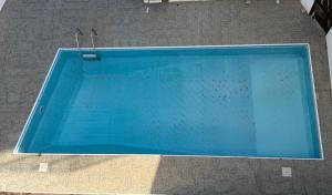 an overhead view of an empty swimming pool at Venus sea view in Paphos